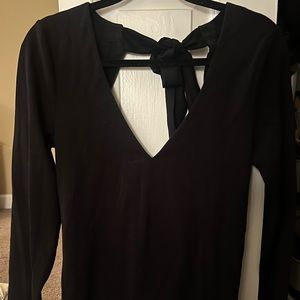 Black shirt with cut out in the back with a bow.